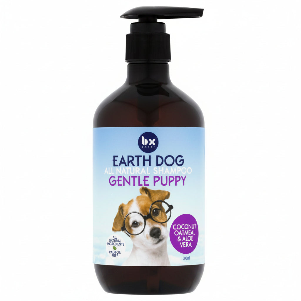 A bottle of BX Earth Dog Gentle Natural Shampoo for puppies, with a label featuring a puppy wearing glasses and the text 'coconut, oatmeal & aloe vera'.